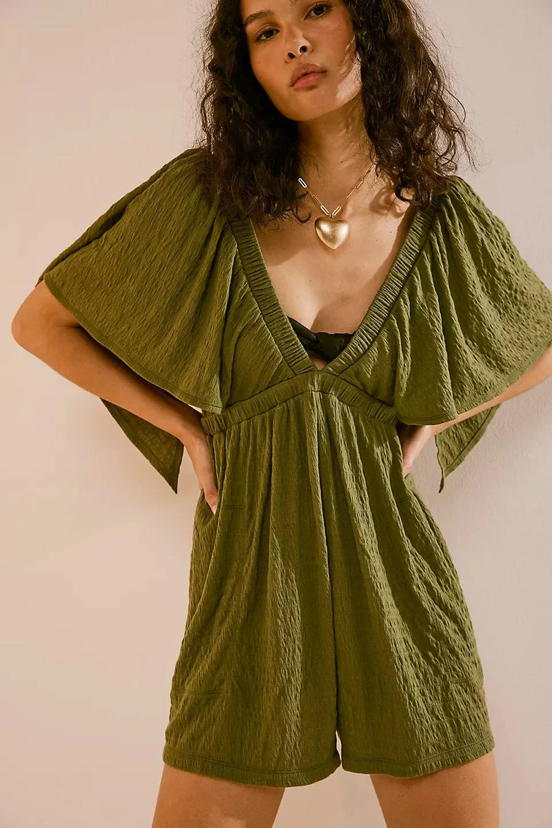 Bohemian Flare Jumpsuit: Deep V-Neck Open Back Romper with Flowy Silhouette for Women