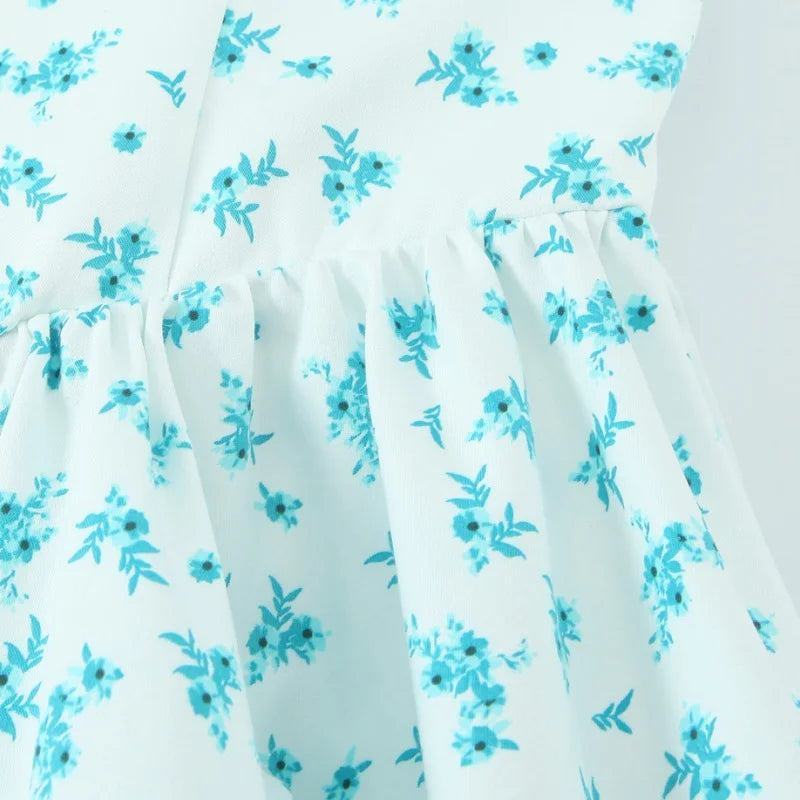 EDSA Women's Floral Mini Dress - Backless Beach Sundress w/ Thin Straps, Empire Waist & Side Pockets | Summer 2025